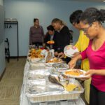 alumni breakfast attendees choosing breakfast