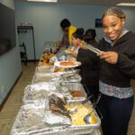 alumni breakfast excited attendees choosing breakfast