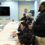 picture of alumni attending a session